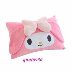 a pink pillow with a hello kitty face on it's side and a bow at the top