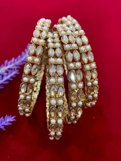 Polki bangles with pearl details. Comes in a set of 4. Elegant Festive Pearl Bracelets, Elegant Festive Pearl Bangle Bracelet, Festive Pearl Bangle Jewelry, Pearl Bangle For Wedding, Polki Bangles, Pearl Details, Bangle Bracelets, Jewelry Bracelets, Bangles