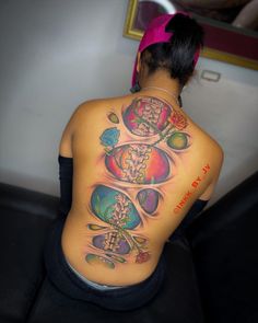 a woman with a tattoo on her back