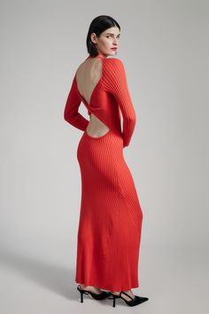 All dressed up, everywhere to go. The Amaro Knit Maxi Dress is made from a soft knit fabrication in a shape that combines a signature sensuality and ease. It features a maxi length, open back with a twist detail, long sleeves, flared hem and a round neckline.SIZING: Slim fit. AU: Model wears a size 8 / US: Model wears a size 4.FABRICATION: 100% viscose. Exclusive of trims. - Round neckline - Long sleeves - Maxi length - Twist back cutout feature - Kick-out at hem Day To Night Dresses, Knit Maxi Dress, Wide Jeans, Maxi Knit Dress, Long Sleeve Maxi, Party Tops, Red Fire, Red Fashion, Jeans Dress