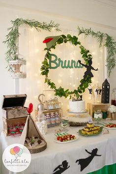 a table topped with lots of food and desserts