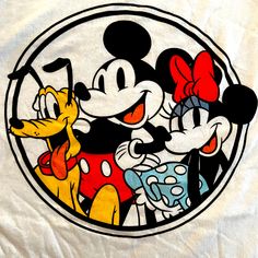 the mickey mouse and pluto t - shirt is printed on a white sheet with red, yellow, and blue polka dots