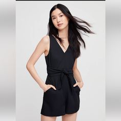 Aritzia | Wilfred Ecoulement V-Neck Tie Waist Cutout Romper Black Size 8 - Bnwt: -This Romper Version Of The Coulement Has A Subtle Back Cut Out And A Self-Tie Waist. It's Made From A Luxe Japanese Crepe With An Intricate Basketweave Texture. Invisible Zipper At Back Adjustable Wrap Tie At Waist Fully Lined Fabric From Japan, Made In China 100% Polyester; Lining: 100% Polyester Dry Clean Questions? Leave A Comment Below! Japanese Crepe, Silk Romper, Aritzia Pants, Black One Piece, Aritzia Wilfred, Cute Rompers, Sleeveless Rompers, Long Jumpsuits, Black Romper