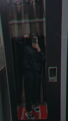 a person taking a selfie in a mirror