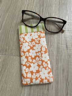 This is a handmade soft case eyeglass case, which means they won’t protect your frames from a brick falling on them, but they will be protected from getting scratched up from your keys or other objects that might leave scratches. This eyeglass holder is made with 100% cotton fabric for the exterior and lining portion. I used Thermolam Plus, an extra loft needled fleece for the middle layer to give the case support while keeping it soft. It also has a snap closure to securely hold glasses in the case. The case measures approximately 3 inches wide by 7 inches tall. This lightly padded fabric case can fit most reading glasses, and slim to regular eyeglasses and sunglasses. Fabric Glasses Case, Glasses Cases To Sew, Sunglass Pouch, Eye Glasses Case, Flat Iron Curls, Diy Bags, Cases Diy, Eyeglass Holder, Quilted Pillow