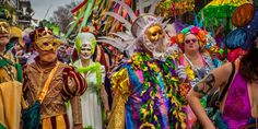 a group of people dressed in colorful costumes