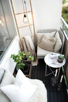 small balcony with white furniture and plants