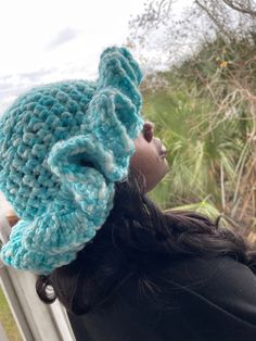 a close up of a person wearing a knitted hat