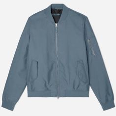 Everlane The Bomber Jacket | Uniform A New Take On The Ma-1 Flight Jacket Style. Ours Is Made Of A Recycled, Water-Resistant Polyester Blend And Complete With Magnetic Closure Pockets And A Two-Way Zipper. Faded Blue Everlane Long Sleeve Winter Outerwear, Everlane Winter Outerwear With Long Sleeves, Fitted Blue Outerwear With Ribbed Cuffs, Blue Outerwear With Ribbed Cuffs For Fall, Everlane Winter Outerwear With Pockets, Casual Everlane Outerwear With Pockets, Everlane Outerwear With Pockets For Fall, Blue Cotton Outerwear With Zipper Closure, Everlane Winter Workwear Outerwear