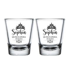 two shot glasses sitting next to each other on a white surface with the words sepina quinefamenera printed on them