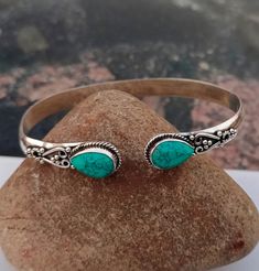 Turquoise Gemstone Bangle * 925 Sterling Silver *Handcraft Silver Bangle * Gift Item * Designer Bangle * Birthday Gift * Pear Shape Gemstone All my Designs are original. Stone - Turquoise Stone Shape - Pear Setting - Bezel This Bangle is for Women You will receive a Bangle like the one in the pictures This Bangle have 925 Stamp Suitable for use in everyday situations, or can also be used as a gift. Unique design will make a special attraction for the wearer. I make my jewelry with passion and love. The perfect gift for a Special occasion Wholesale Orders Accept on Wholesale Price All Pieces Have 925 Stamp Bohemian Turquoise Sterling Silver Bracelet, Turquoise Birthstone Bracelet, Adjustable Turquoise Bracelet With Birthstone, Bohemian Sterling Silver Bracelet With Gemstone For Gift, Bohemian Sterling Silver Gemstone Bracelet Gift, Bohemian Stamped 925 Bracelet Gift, Adjustable Turquoise Jewelry For May Birthstone, Handmade Turquoise Sterling Silver Bangle Bracelet, Handmade Turquoise Sterling Silver Bangle