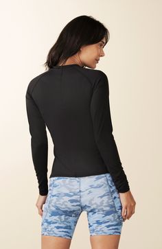 Streamlined Long Sleeve Top, a lightweight workout layer that's as versatile as it is stylish. Whether you're practicing yoga or embracing an active lifestyle beyond the studio, this top is a forward stunner that effortlessly elevates your look.  At LOSANO we help elevate every moment with clothing that is better for you! Crew neck Curved contrast panels Body skimming Split hem PFA Free BPA Free Moisture wicking Breathable UV Protective Made from sustainable materials 79% Recycled Polyester 21% High Stretch Tops With Built-in Padding For Pilates, Fitted Yoga Top With Built-in Padding, Black Go-dry Top For Yoga, Black Go-dry Tops For Yoga, Functional Stretch Tops For Layering, Fitted Versatile Top For Yoga, Versatile Fitted Yoga Top, Versatile Fitted Top For Yoga, Fitted Athleisure Tops With Built-in Padding