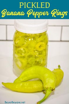 pickled banana pepper rings in a glass jar with the words pickled on it