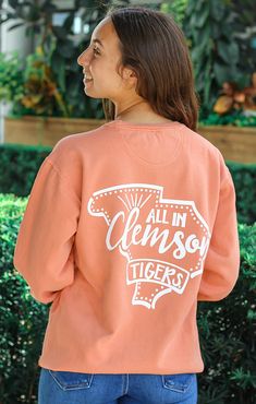 Since you guys loved the Pep Squad Comfort Tee - we brought it back as a Pullover! The Clemson Pep Squad Pullover is going to keep you cozy all year round, especially on those chilly game days! Style it with your favorite pair of biker shorts, leggings, shorts, or jeans! We recommend sticking to your regular size but if you want more of an oversized look size up! Details: *OFFICIALLY LICENSED* Clemson Tigers Crew Neck Long Sleeve 100% Cotton Light Weight Relaxed Fit True to Size Anabella is wear Fall Fan Gear Tops With Lettering, Fall School Spirit Tops For Campus Wear, Fall School Spirit Tops For College Events, Sporty Tops For College Events In Fall, Casual Tops For College Events In Fall, Casual Fall Tops For College Events, Pep Squad, Semi Annual Sale, Leggings Shorts