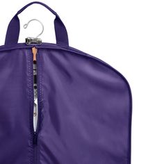 a purple garment bag hanging on a hook