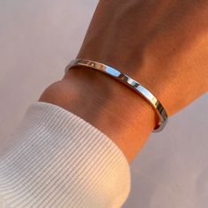 The bracelet is made of stainless steel. It features a contemporary design and will complement any outfit beautifully. Material: Stainless steel. Finish: Rhodium plated/18k Gold Plated. Width: 4mm. Inner circumference: 17.3 cm. Inside measurement : 6cm*5cm. 🔸more from us🔸 https://www.etsy.com/shop/DoraJewelryAccessory Minimalistic Bracelet, Oval Bangle, The Bangles, Bracelet Minimalist, Bracelet Simple, Simple Bracelets, Minimalist Bracelet, Dainty Jewelry, Silver Bangles