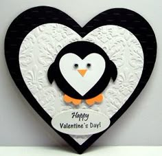 a black and white heart shaped card with a penguin on it's face in the shape of a heart