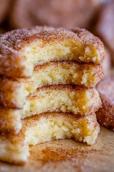 a stack of sugar covered donuts sitting on top of a table