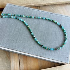 Beautiful dainty gemstone with mixed metal findings includes blue apatite, turquoise, green onyx, pyrite, hematite gemstones.   Only 1 necklace is included in this listing. Details: - Multiple gemstones include blue apatite, turquoise, green onyx, hematite (gold & silver) and pyrite - Sterling silver lobster clasp & extender chain - Length of the necklace - 16" + 2" extender chain NOTE: Only 1 necklace is included in this listing - the mixed gemstone beaded necklace, the wire wrapped multi gemst Handmade Green Turquoise Necklace In Amazonite, Turquoise Single Strand Amazonite Beaded Necklace, Adjustable Turquoise Beaded Amazonite Necklaces, Turquoise Beaded Necklace For A Gift, Adjustable Blue Gemstone Beaded Necklace, Single Strand Turquoise Chrysocolla Necklace, Turquoise Amazonite Gemstone Beads Necklace, Green Single Strand Beaded Necklace In Amazonite, Adjustable Turquoise Chrysocolla Beaded Necklaces