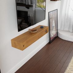 there is a wooden shelf on the wall