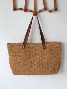 Luxury Handmade Bags For Vacation, Luxury Brown Crochet Bag For Daily Use, Luxury Everyday Straw Tote Bag, Luxury Straw Tote Bag For Everyday, Luxury Handmade Natural Straw Bag, Luxury Brown Crochet Bag For Summer, Luxury Brown Crochet Beach Bag, Elegant Crochet Tote Bag For Beach, Elegant Handwoven Brown Beach Bag