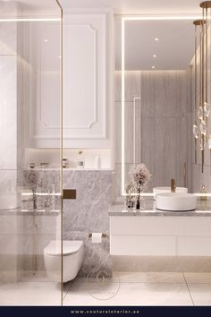 an elegant bathroom with marble and gold accents