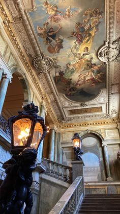 an ornate ceiling and chandelier in a building