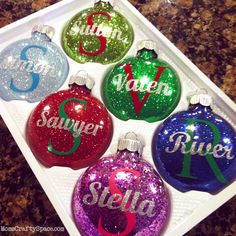 six personalized christmas ornaments in different colors