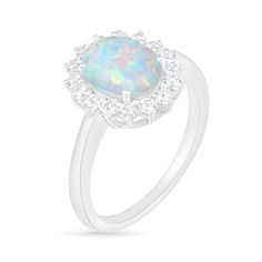 This fashion ring is a beautiful addition to your collection. Created in sterling silver, this choice showcases a 9.0 x 7.0mm oval-shaped lab-created iridescent opal wrapped in a starburst frame of lab-created shimmering white sapphires. This design is custom-made to fit her ring size. Sterling silver rings cannot be resized after purchase. Dazzling Oval Opal Ring, Fine Jewelry Sterling Silver Oval Opal Ring, Silver Oval Cabochon Jewelry With Center Stone, White Oval Sterling Silver Halo Ring, Oval White Sterling Silver Halo Ring, Oval Halo Setting Birthstone Ring, Classic Opal Ring With Accent Stones, Silver Oval Opal Ring Fine Jewelry, Fine Jewelry Silver Opal Ring In Oval Shape