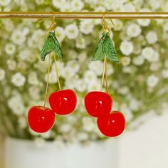 Beautiful cherry earrings with resin cherry and leaf charms and brass earring hooks. Perfect for party, beach and boho wear. Drop length =  70mm  7cm   2.75 inches Charm width  30mm   3cm    1.2 inches Processing time is 24-48 hrs Mon-Fri. 24-72 hrs for weekend and holiday orders due to post office opening times. Retro Red Earrings For Summer, Summer Gift Cherry Earrings, Cherry Colored Earrings For Summer Party, Cherry Color Earrings For Summer Party, Boho Wear, Cherry Earrings, Fruit Earrings, Party Earrings, Earrings Green