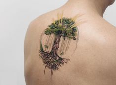 a man with a tree tattoo on his back