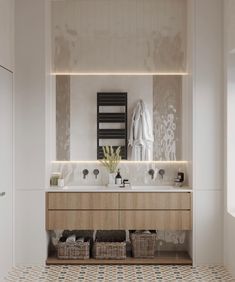 a bathroom with two sinks and a towel rack on the wall next to each other