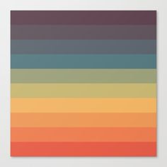 an orange, yellow and blue striped poster on a white wall with the colors of the rainbow