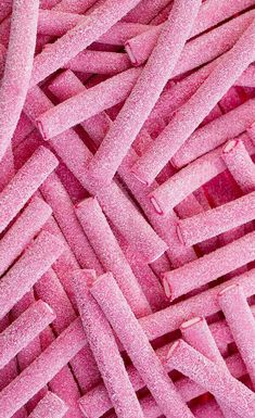 close up view of pink candy canes in the form of an interlocked pattern