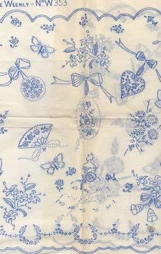 an old blue and white handkerchief with flowers, hearts, and other things on it