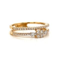 two gold rings with diamonds on each side and one diamond in the middle, set against a white background