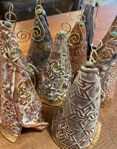 Pottery ornaments are handmade in Helena, Montana by Donna Erickson, an Apache and Cherokee descendant. Each ornament, includes an interior bell, and measures approximately 7" from hook to end. Christmas Pottery, Pottery Christmas, Clay Christmas Decorations, Helena Montana, Pottery Ornaments, Clay Christmas, Slab Pottery, Pottery Classes, Xmas Decor