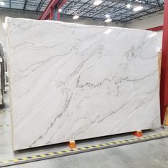 a large white marble slab in a warehouse