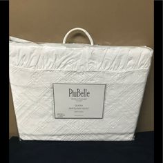 a white bag sitting on top of a table