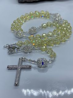 High quality and beautifully unique Catholic Rosary beads made with Swarovski crystals. Perfect for Christenings/Baptisms, wedding gifts/favours, Holy Communions and every other occasion. This beautiful Rosary is made using top quality materials. Silver 49 strand wire-for added strength and durability, exquisite silver and zircon crucifix approximately 4cm x 2.5cm L/W. Lovely silver miraculous medal, delicate and aesthetically pleasing French wire, Miyuki seed beads, silver and sterling silver e Elegant Adjustable Rosary With Silver Beads, Elegant Silver Beads Rosary Gift, Swarovski Jewelry Necklace, Silver Faceted Beads Rosary Cross, Silver Hand-strung Rosary As Gift, Gold Hand-strung Spiritual Rosary, Rosary Beads Catholic, Rosary Jewelry, Swarovski Beads