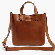 Madewell The Small Transport Crossbody G8078. 3 1/2" Handle Drop. 19" (At Shortest) To 21 5/8" (At Longest) Crossbody Drop. 7 3/4"H X 7 3/4"W X 2 5/8"D. Defect: Monogrammed, Excellent Condition Inside And Out A Small (But Surprisingly Roomy) Take On Our Best-Selling Medium Transport Tote. What Goes Into It? Here It Is By The Numbers: 2 Pieces Of Fine Leather Are Used For The Body. 2 Ways To Carry: With The Top Handles Or The Detachable Shoulder Strap. 1 Exterior Pocket For Those Things You Gotta Madewell Bags, Fall Handbags, Saddle Leather, Mini Crossbody Bag, Crossbody Tote, Leather Handbag, Handbags On Sale, Salvatore Ferragamo, Leather Crossbody Bag