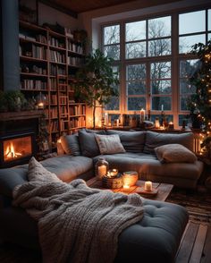 a living room filled with furniture and candles