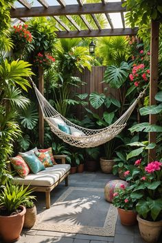 a hammock in a garden with potted plants