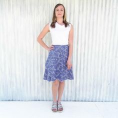 "A classic style with a unique print, the bird skirt is sure to attract some compliments. This midi wrap skirt is made from a mid weight 100% organic cotton straight weave fabric featuring a bird print in midnight blue. It wraps nearly twice around for great coverage and is easily adjustable so it's never too tight. *Mid length *Adjustable fit *22\" long (can be customized) SIZES Made to order in sizes XS-3X or Custom. See images for size chart and measurement guide. COLOR Pictured in Midnight M Blue Fitted Wrap Skirt For Casual Wear, Casual Fitted Wrap Skirt, Fitted Casual Wrap Skirt With Gathered Detail, Casual Fitted Wrap Skirt With Gathered Detail, Fitted Blue Cotton Wrap Skirt, Bird Skirt, Straight Weave, Organic Cotton Leggings, Midi Wrap Skirt