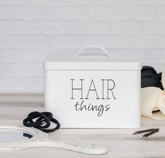 "Maintain Your Space Mess-Free With The Most Practical Hair Things Accessory Storage Box! Looking for a hair product organizer to keep your bathroom countertop clean? Want a scrunchie holder with a lid to store all your favorite hair ties? Need a stunning hair bow container for girls to treat your daughter? Now you don't have to settle for a cheaply-made hair tool organizer, an old-fashioned bathroom cabinet organizer for your hair essentials, or a bulky hair tie container that will take up all Hair Tie Storage, Product Organizer, Bathroom Cabinet Organizer, Hair Tool Storage, Scrunchie Holder, Hair Tie Holder, Styling Essentials, Metal Organizer, Vanity Shelf