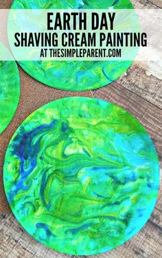 two green and blue plates with the words earth day shaving cream painting on them