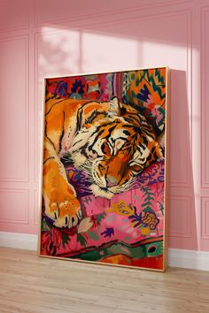 a painting on the wall of a room with pink walls and wood flooring in front of it