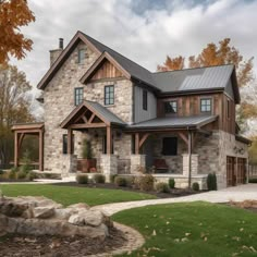 a large stone and wood house with lots of windows