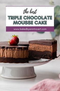 the best triple chocolate mousse cake is on a white plate with a strawberry