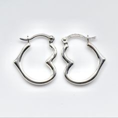 Beautiful Pair Of Heart Shaped Hoop Earrings. They Are 14k White Gold, Stamped On The Posts. The Earrings Measure 15mm Long Or 5/8ths Of An Inch. They Weigh .45 Grams. Brand New, Great Gift! White Gold Huggie Jewelry For Valentine's Day, Hypoallergenic White Gold Round Heart Earrings, Valentine's Day White Gold Huggie Jewelry, Elegant Sterling Silver Huggie Earrings With Heart Charm, Small Hoop Sterling Silver Heart Earrings Hypoallergenic, Sterling Silver Huggie Earrings For Gifting, Heart-shaped White Gold Hoop Earrings For Valentine's Day, White Gold Heart-shaped Hoop Earrings For Valentine's Day, Gift Sterling Silver Huggie Earrings